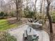 Outdoor patio area with a built-in grill, seating, and a fireplace, perfect for entertaining at 3359 Hampton Rd, Raleigh, NC 27607