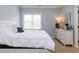 Relaxing bedroom features a plush bed, dresser, and a neutral color scheme, creating a calming atmosphere at 3359 Hampton Rd, Raleigh, NC 27607