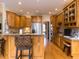 Spacious kitchen featuring wooden cabinetry, granite countertops, and stainless steel appliances at 3359 Hampton Rd, Raleigh, NC 27607