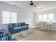 Comfortable living room with a couch, stools, and windows for natural light at 3359 Hampton Rd, Raleigh, NC 27607