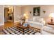 Cozy living room with fireplace, hardwood floors, and elegant furnishings at 3359 Hampton Rd, Raleigh, NC 27607