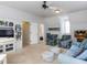 Spacious living room with ample seating, built-in shelving, and a ceiling fan for comfort at 3359 Hampton Rd, Raleigh, NC 27607