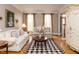 Comfortable living room with hardwood floors, sofas, and decorative accents at 3359 Hampton Rd, Raleigh, NC 27607