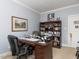 Functional office with dark wood desk, storage, and decorative elements at 3359 Hampton Rd, Raleigh, NC 27607