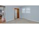 Comfortable bedroom with carpet, a built-in closet, and a view of the exterior at 4166 Nc 119, Mebane, NC 27302