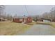Charming red brick home with a covered carport and a well-maintained front yard at 4166 Nc 119, Mebane, NC 27302