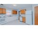 Bright kitchen featuring white appliances, laminate countertops, and ample cabinet space at 4166 Nc 119, Mebane, NC 27302
