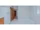 Simple kitchen design with an adjoining doorway, view to backyard, and white appliances at 4166 Nc 119, Mebane, NC 27302