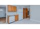 Efficient kitchen design with white appliances, laminate countertops, and wood cabinets at 4166 Nc 119, Mebane, NC 27302