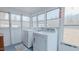 Bright laundry room with large windows and white washer and dryer at 4166 Nc 119, Mebane, NC 27302