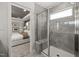 Modern shower features glass enclosure, gray tiling and access to main bedroom at 521 Providence Springs Ln, Fuquay Varina, NC 27526