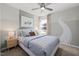Charming bedroom with road-themed wall art, soft blue bedding, and natural light, creating a playful and inviting space at 521 Providence Springs Ln, Fuquay Varina, NC 27526