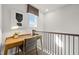 Bright and airy loft space with a modern desk setup, perfect for a home office or study area with ample natural light at 521 Providence Springs Ln, Fuquay Varina, NC 27526