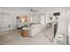This well-lit loft area features neutral tones, plush carpeting, and stylish furnishings for a cozy and inviting atmosphere at 521 Providence Springs Ln, Fuquay Varina, NC 27526