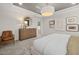 Bright and cozy main bedroom featuring plush carpeting and a decorative mirror at 521 Providence Springs Ln, Fuquay Varina, NC 27526