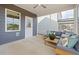Cozy screened porch with comfortable seating, a coffee table, and serene views, ideal for relaxation and enjoying the outdoors at 521 Providence Springs Ln, Fuquay Varina, NC 27526