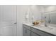 Bright bathroom featuring double sinks, quartz countertops and tiled shower at 607 Dorset Stream Dr, Fuquay Varina, NC 27526