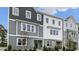 Charming townhome featuring eye-catching two-tone color scheme, and well-manicured landscaping at 607 Dorset Stream Dr, Fuquay Varina, NC 27526