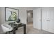 Neutral hallway features a desk with a globe and decor and an adjacent room at 607 Dorset Stream Dr, Fuquay Varina, NC 27526