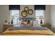 Inviting bedroom with patterned wallpaper, decorative wall art, and soft lighting offering a cozy, restful space at 609 Dorset Stream Dr, Fuquay Varina, NC 27526