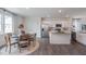 Dining area featuring a kitchen view with stainless steel appliances and an island at 609 Dorset Stream Dr, Fuquay Varina, NC 27526