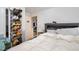 Bright bedroom featuring a large bed, shoe rack, and access to another room at 628 East Ave, Henderson, NC 27536