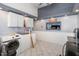 Bright laundry room with modern washer and dryer, storage cabinets, and tile floor at 628 East Ave, Henderson, NC 27536