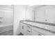 Bathroom featuring granite countertops, white cabinets and updated fixtures, and bathtub/shower combo at 631 Contento Ct, Sanford, NC 27330