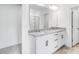 Bright bathroom featuring double vanity with granite countertop, updated fixtures, and walk in shower at 631 Contento Ct, Sanford, NC 27330