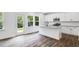 Bright kitchen with stainless steel appliances, granite countertops, island, and access to the backyard at 631 Contento Ct, Sanford, NC 27330