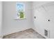 Laundry room with window view and utility connections offers convenience at 631 Contento Ct, Sanford, NC 27330