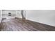 Spacious living room featuring hardwood floors and plenty of natural light with view to the kitchen at 631 Contento Ct, Sanford, NC 27330