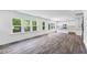 Bright and spacious living room and open floorplan with natural light, hardwood floors, and backyard access at 631 Contento Ct, Sanford, NC 27330