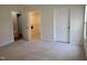 The bedroom features neutral carpeting and easy access to a walk-in closet at 631 Natalie Dr, Graham, NC 27253