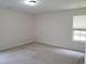 Large bright bedroom with wall-to-wall carpet and a window at 631 Natalie Dr, Graham, NC 27253