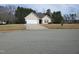 Charming single Gathering home with a white garage door, neutral siding, and a well-maintained yard at 631 Natalie Dr, Graham, NC 27253