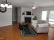 Comfortable living room features a cozy fireplace, ceiling fan, and access to the outdoor patio at 631 Natalie Dr, Graham, NC 27253