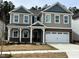 Beautiful two-story home with a two-car garage and covered entryway at 660 Sun Meadow Dr, Wake Forest, NC 27587