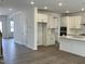 Bright kitchen featuring white cabinets, stainless appliances, and a center island at 660 Sun Meadow Dr, Wake Forest, NC 27587