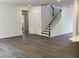 Spacious living room with hardwood floors and staircase at 660 Sun Meadow Dr, Wake Forest, NC 27587