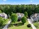 Beautiful aerial shot showcasing a well-maintained home with lush trees and manicured lawns at 6829 Palaver Ln, Cary, NC 27519