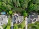 Aerial view of home featuring a manicured backyard, patio and garden area, and mature trees at 6829 Palaver Ln, Cary, NC 27519