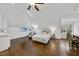 Large bedroom with hardwood floors, a pitched ceiling, and ample natural light at 6829 Palaver Ln, Cary, NC 27519