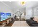 Well-lit bonus room with hardwood floors, TV, seating area, and ample storage space at 6829 Palaver Ln, Cary, NC 27519