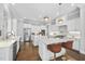 Gourmet kitchen with dual islands, stainless steel appliances, and custom white cabinetry at 6829 Palaver Ln, Cary, NC 27519
