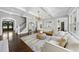 Elegant living room featuring coffered ceilings, modern lighting, and a stylish seating area at 6829 Palaver Ln, Cary, NC 27519