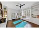 Versatile living space, featuring a window bench, built-in shelving, and hardwood floors, perfect for relaxing or exercising at 6829 Palaver Ln, Cary, NC 27519