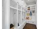 Well-organized mudroom with custom lockers, storage cabinets, and a comfortable bench for convenient organization at 6829 Palaver Ln, Cary, NC 27519