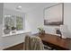 Bright office space with large window and built in bench, perfect for a productive work from home environment at 6829 Palaver Ln, Cary, NC 27519