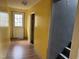 Hallway with laminate floors and view of stairs and back door at 731 Latimer St, Hillsborough, NC 27278